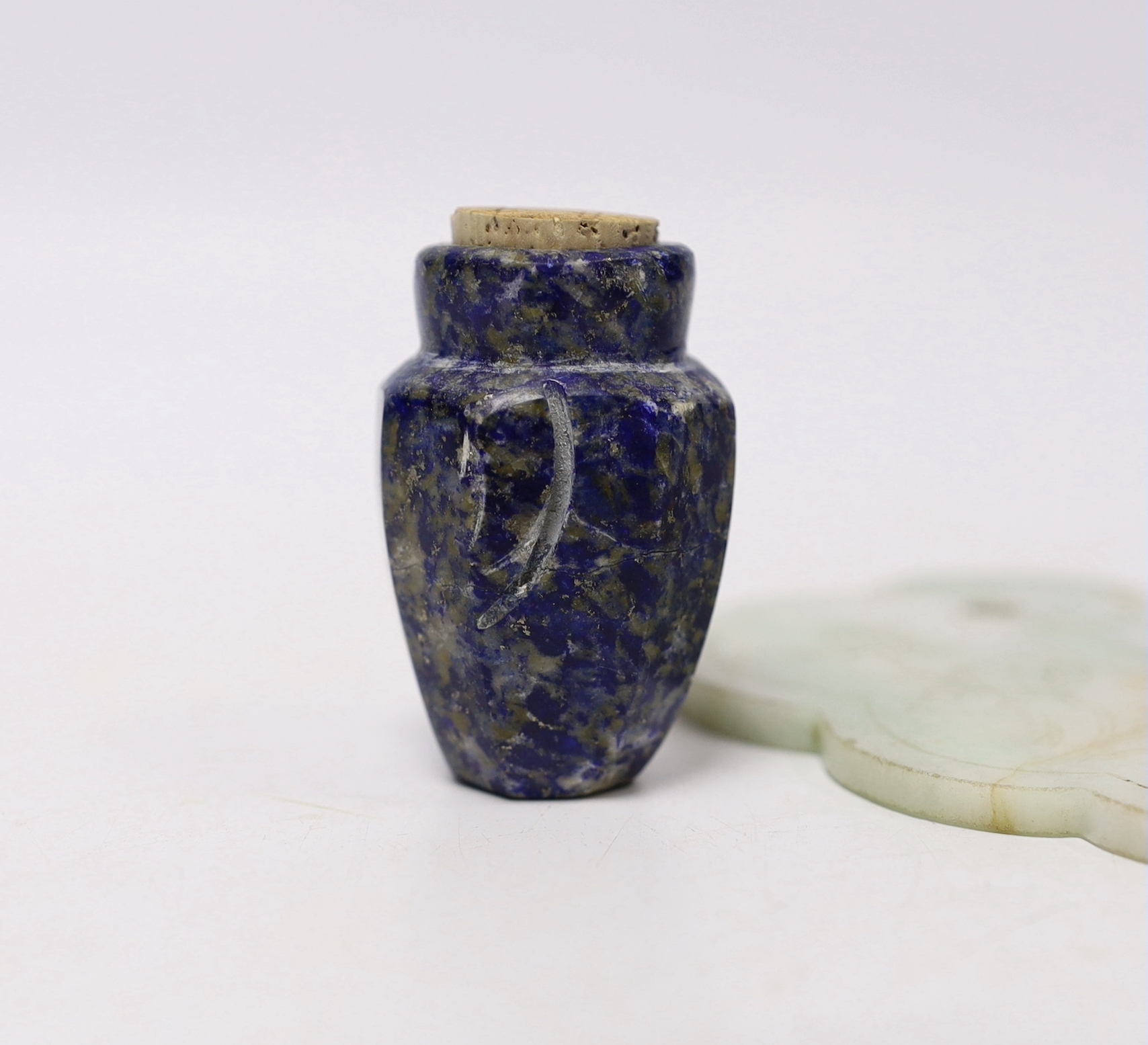 Two Chinese jade carvings and a lapis lazuli snuff bottle, largest 12cm wide